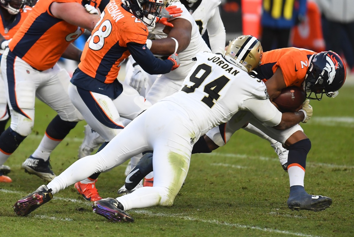 New Orleans Saints defensive end Cameron Jordan (94) sacks Denver quarterback Kendall Hinton (2) . Mandatory Credit: Ron Chenoy-USA TODAY 